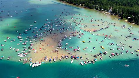Torch lake sandbar - Torch Lake at 19 miles long is Michigan's longest inland lake and at approximately 18,770 acres is Michigan's second largest inland lake. National Geographic rated it the third most beautiful lake in the world. An average property on Torch Lake costs approximately two million dollars. Within it are several townships including Torch Lake ...